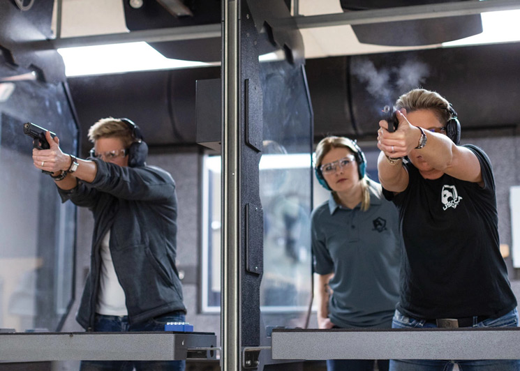 Women training at the shooting range with a USCCA instructor